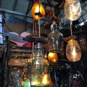 Glass lanterns with warm glowing lights, combined with the rustic charm of our 3 Bulb Hanging Lamps, create a cozy and inviting ambiance.