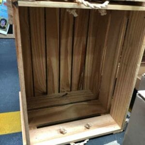 A "Wood crate 1," featuring rope handles, is artfully placed on the floor near a bold yellow line, adding a rustic touch that's reminiscent of Dapitan's signature home designs.