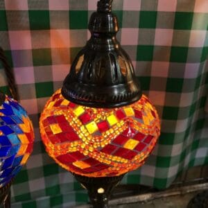 While the Black Container - Small doesn't directly match the theme of a vibrant mosaic lantern, it can add a touch of sophistication to any space with its sleek and modern design.
