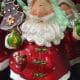 The 6" Santa Claus Figurine from Dapitan holds a decorated, tree-shaped cookie, making it perfect for adding festive flair to your home decor.