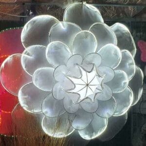 The White Flower Christmas Lantern, a large illuminated decor with layered petals, is beautifully on display in your home, adding a touch of elegance reminiscent of Dapitan's artistic charm.