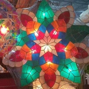 The Big Multi-color Christmas Lantern, with its vibrant red, blue, green, and white stained glass sections in a star shape, brings a Dapitan-inspired charm to your home decor when brightly illuminated.