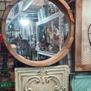 The elegant Wooden Mirror, with its round design, is prominently displayed above decorative panels in the store, infusing the space with a touch of home decor sophistication that echoes Dapitan's distinctive style.
