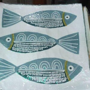 The Throw Pillow Case (Burda) from Dapitan features three stylized blue fish designs on a crisp white background, bringing a touch of coastal elegance to your home decor.
