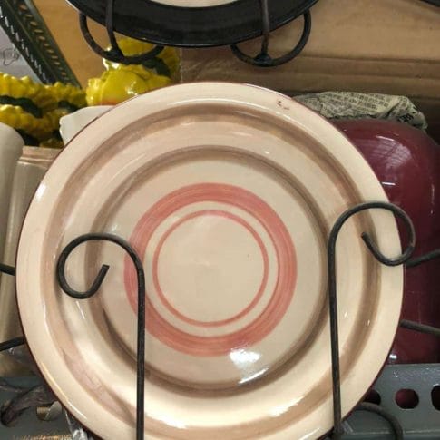 photo_2020-09-03_12-25-45 Glossy Round Ceramic Plates featuring concentric red rings, ideal for dapitan-inspired decor, elegantly displayed on a metal stand to enhance your home's aesthetic.