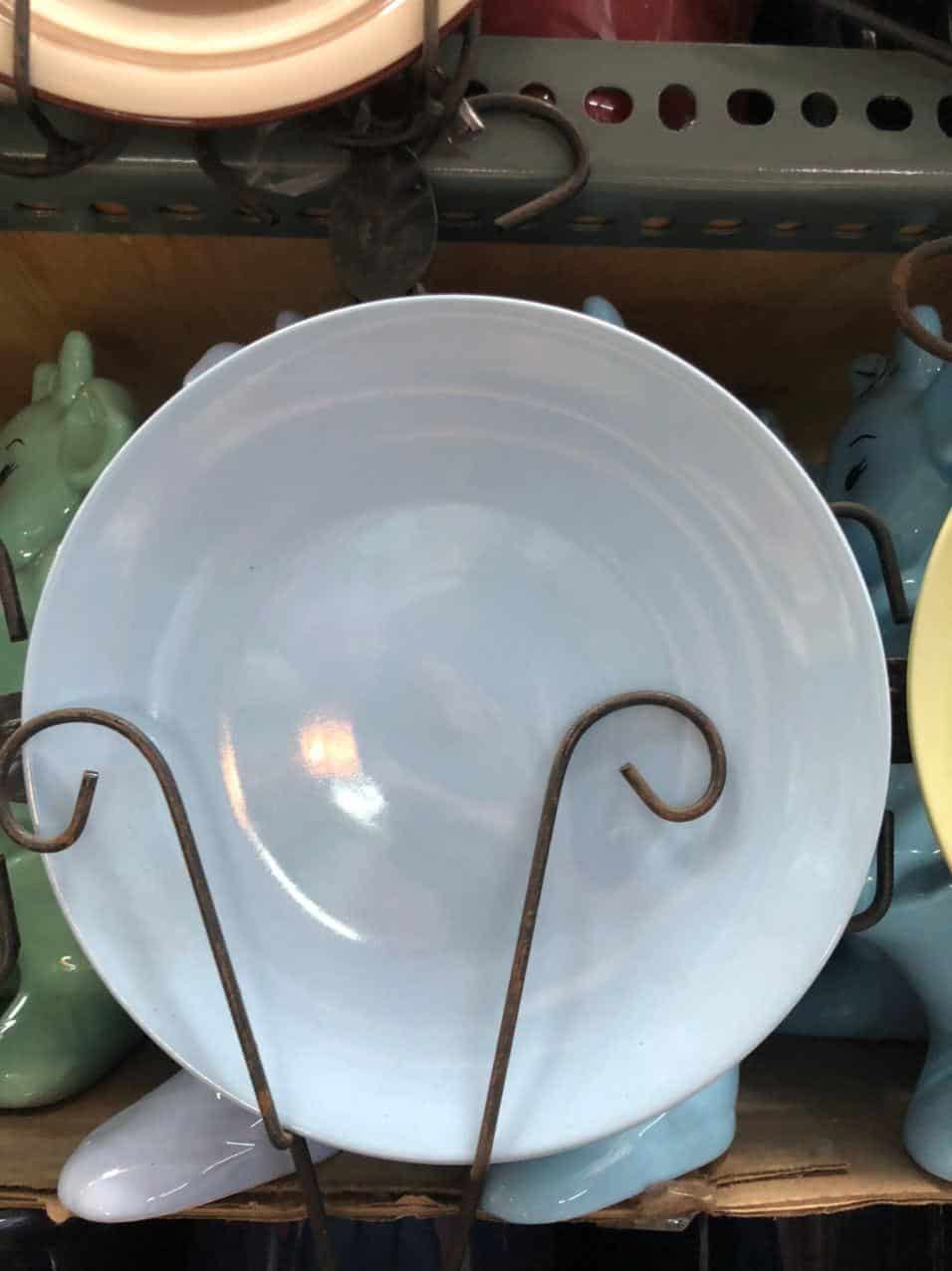Glossy Round Ceramic Plates on a display rack, perfect for adding a touch of Dapitan home decor charm.
