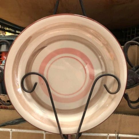 photo_2020-09-03_12-25-55 The Glossy Round Ceramic Plate with pink concentric circles is displayed on a metal rack, adding a touch of delightful decor to your home.