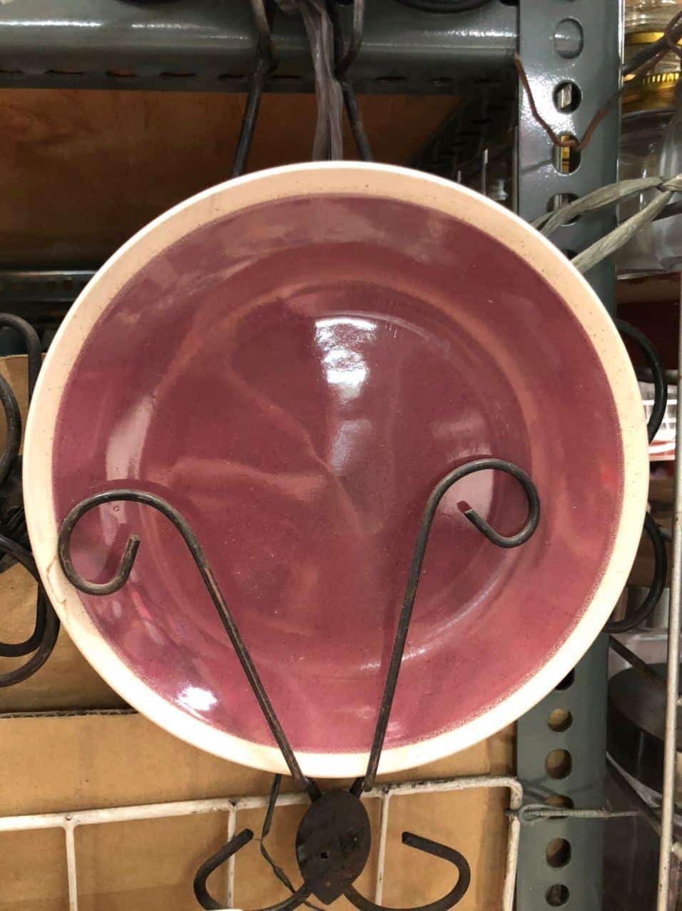 Displayed on a sleek metal stand with curved hooks, these Glossy Round Ceramic Plates in pink add a touch of elegance to your home decor. Perfect for those who seek unique and stylish pieces, they bring a hint of Dapitan-inspired charm to any space.