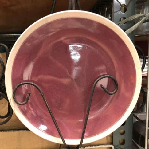 photo_2020-09-03_12-25-56 Displayed on a sleek metal stand with curved hooks, these Glossy Round Ceramic Plates in pink add a touch of elegance to your home decor. Perfect for those who seek unique and stylish pieces, they bring a hint of Dapitan-inspired charm to any space.